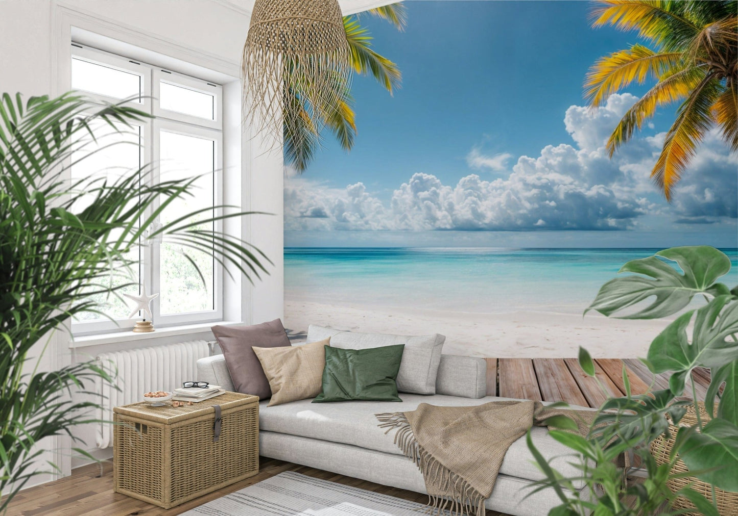 Tropical Beach View wallpaper mural framing a sunny beach behind a white sofa with leafy plants in a bright living room