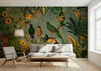 Tropical Explorers' Chart mural of tropical birds behind a white sofa and hairpin-leg coffee table