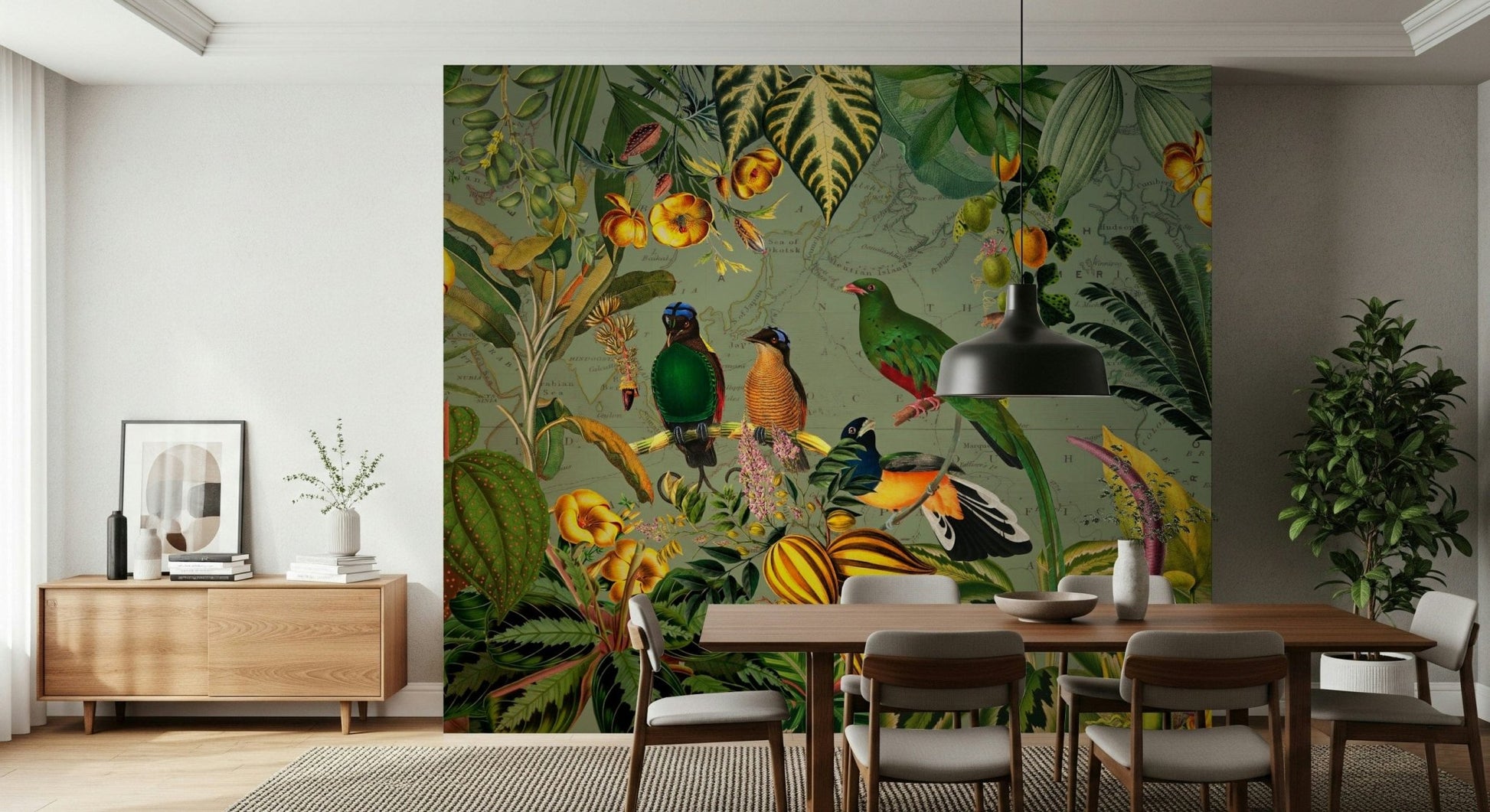 Tropical Explorers' Chart green mural of tropical birds behind a wood dining table and black pendant lamp