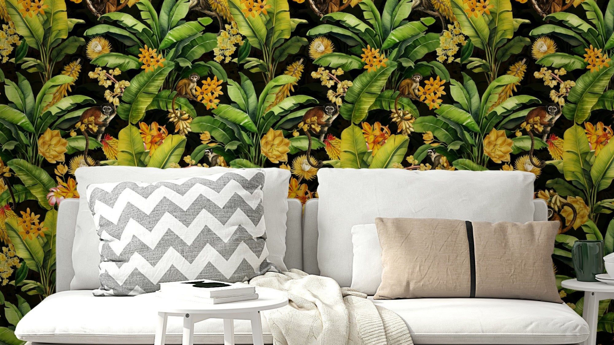 Close-up of monkeys among tropical leaves and colorful blossoms.

