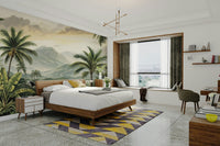 A wall mural of a peaceful mountain landscape with tropical foliage.