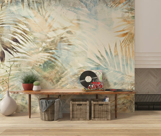 Glimmering Palms wallpaper mural of painterly cream and teal fronds behind a wooden bench with vinyl records in an entryway