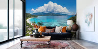 Tropical paradise view wall mural with lush foliage for an entryway wall.