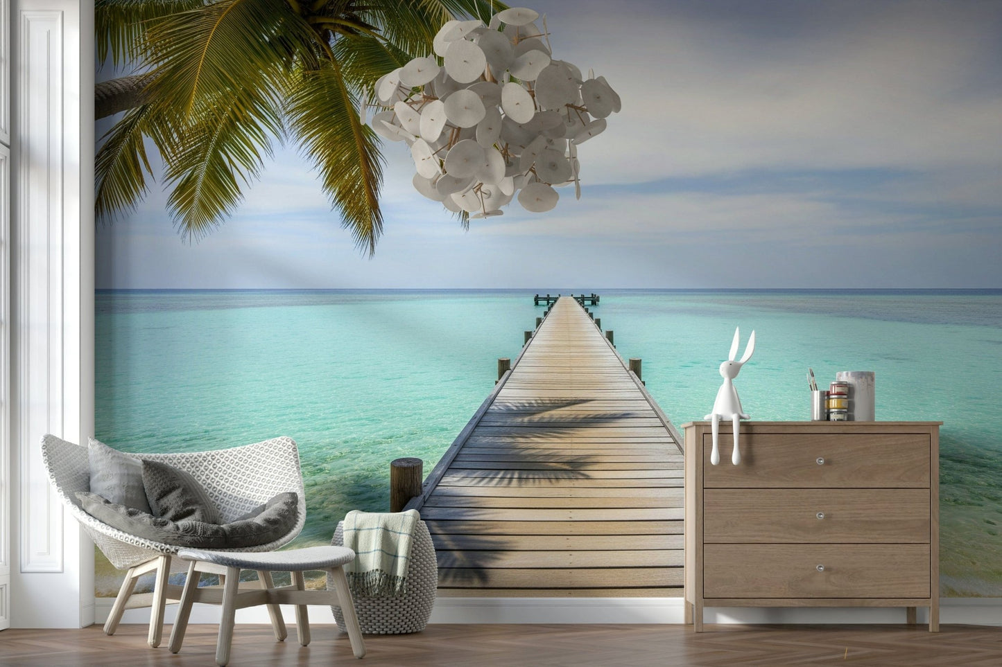 Tropical pier wall mural in modern living room, palm trees, ocean blues, feature wall behind sofa