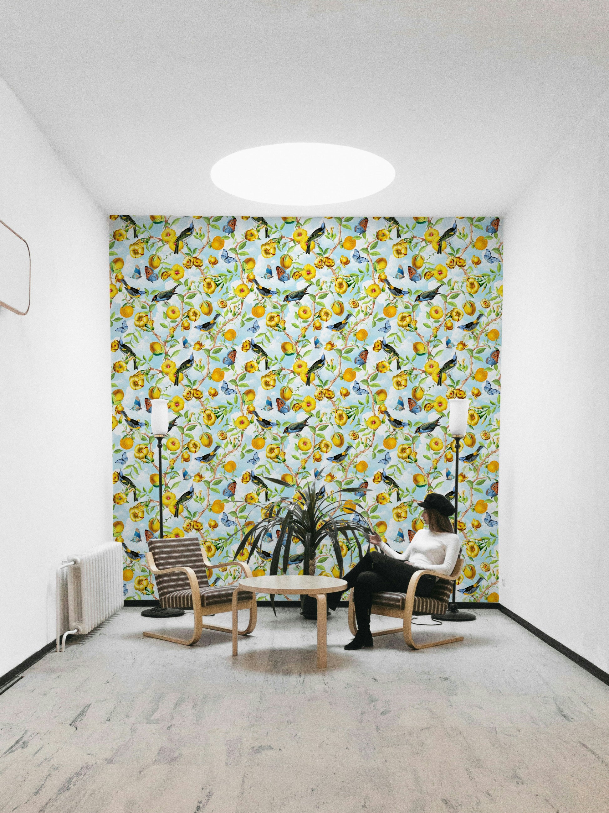 Hand-drawn tropical birds and leaves in a jungle-style mural.

