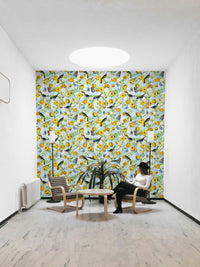 Hand-drawn tropical birds and leaves in a jungle-style mural.

