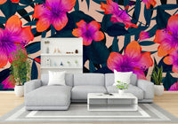 Lush green tropical leaves in a wall mural.

