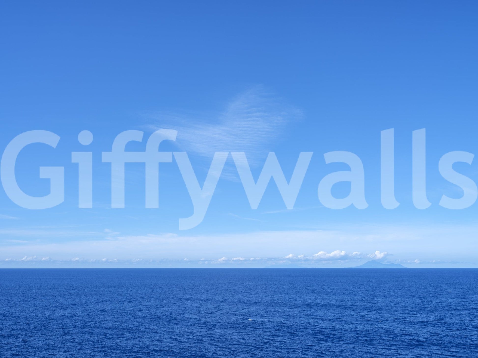 A peaceful marine vista featured on the Turquoise Blue Sea Wall Mural