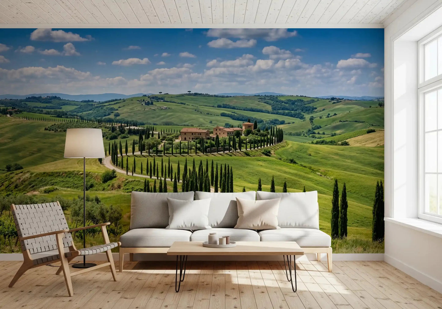 Living area featuring cypress wall mural and layered green hill scenery