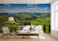 Living area featuring cypress wall mural and layered green hill scenery