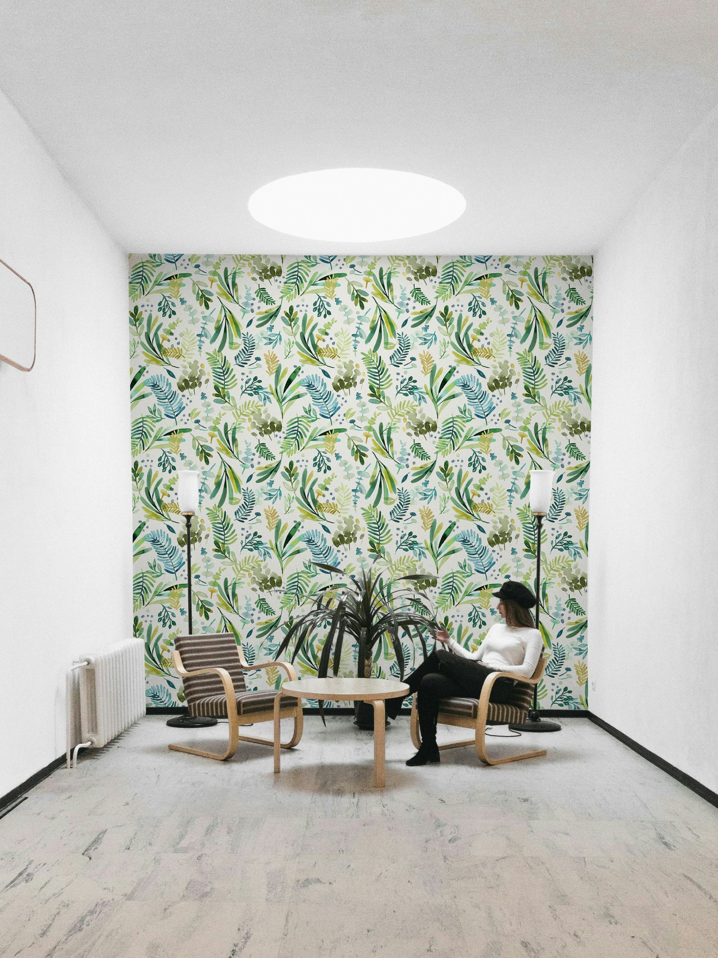 Light botanical mural with flowing olive branch artwork.

