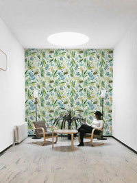 Light botanical mural with flowing olive branch artwork.

