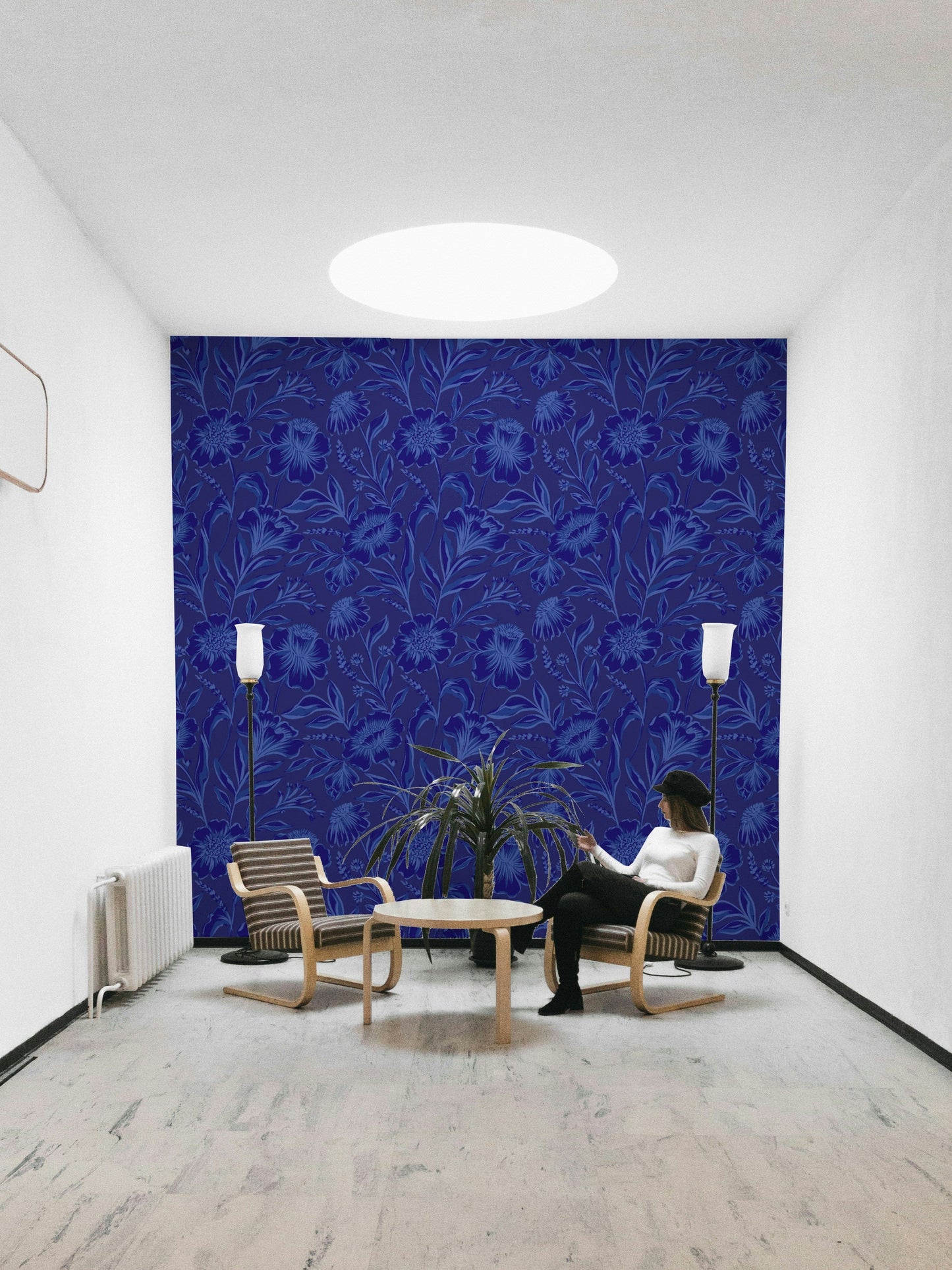 A full-wall mural of a moody floral pattern.
