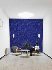 A full-wall mural of a moody floral pattern.
