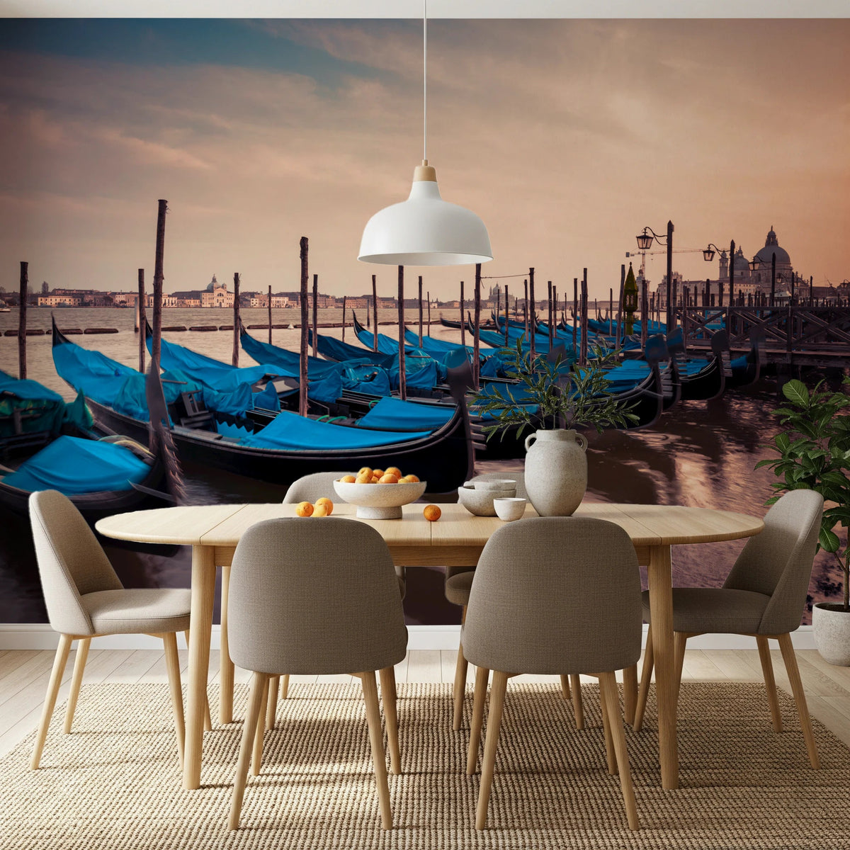 Twilight Gondolas wall mural of blue Venice gondolas at sunset above a wood dining table