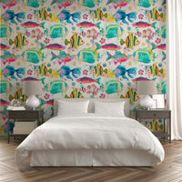 Tropical fish wallpaper on a soft pink background with coral elements.

