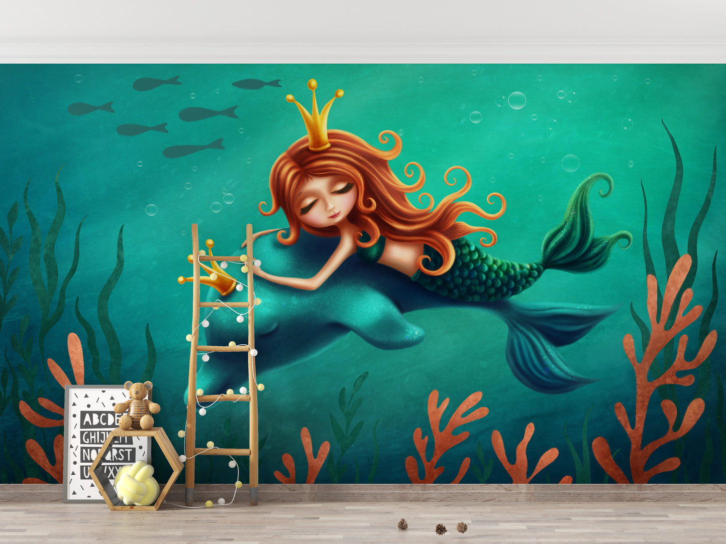 Underwater Mermaid and Dolphin Ride wallpaper mural in teal above a wooden ladder and alphabet print in a nursery