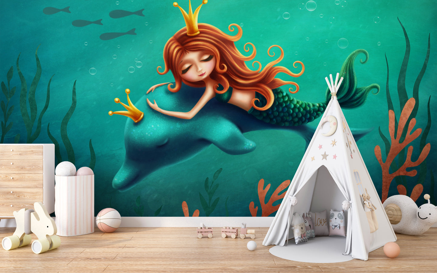Underwater Mermaid and Dolphin Ride wallpaper mural in teal behind a white teepee tent and toys in a kids room