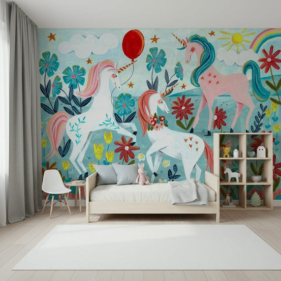 Floral Unicorn Magic wallpaper mural of pink and white unicorns with a red balloon above a wood daybed and cube toy shelf
