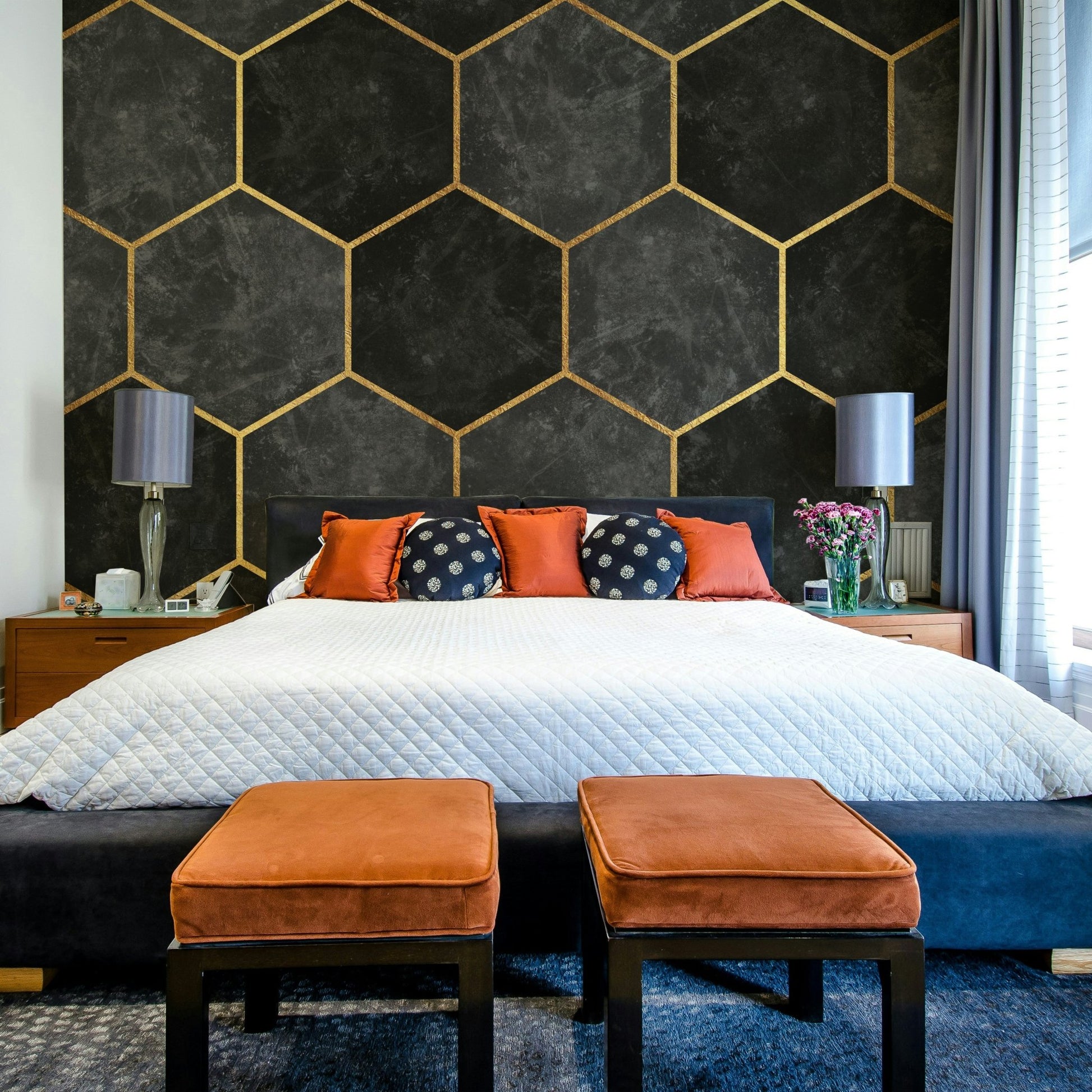 Bold charcoal and gold hexagon wallpaper for a contemporary look.

