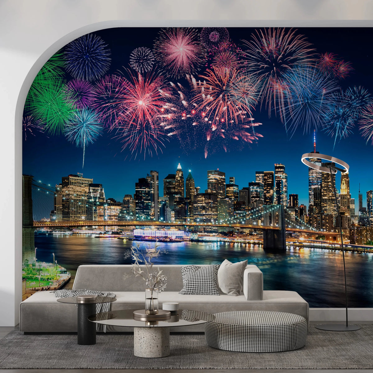 Urban Fireworks wallpaper mural of fireworks over the NYC skyline above a grey sofa in a living room