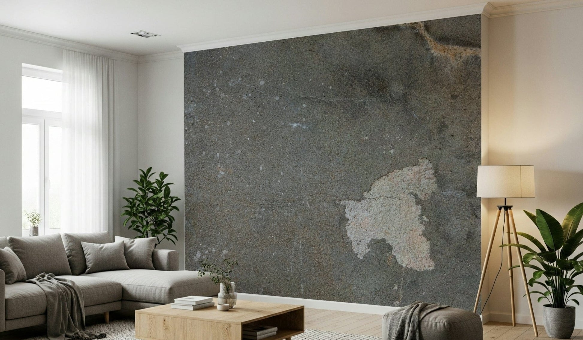 Urban Gray Industrial wallpaper mural in dark gray concrete behind a gray sectional and tripod floor lamp