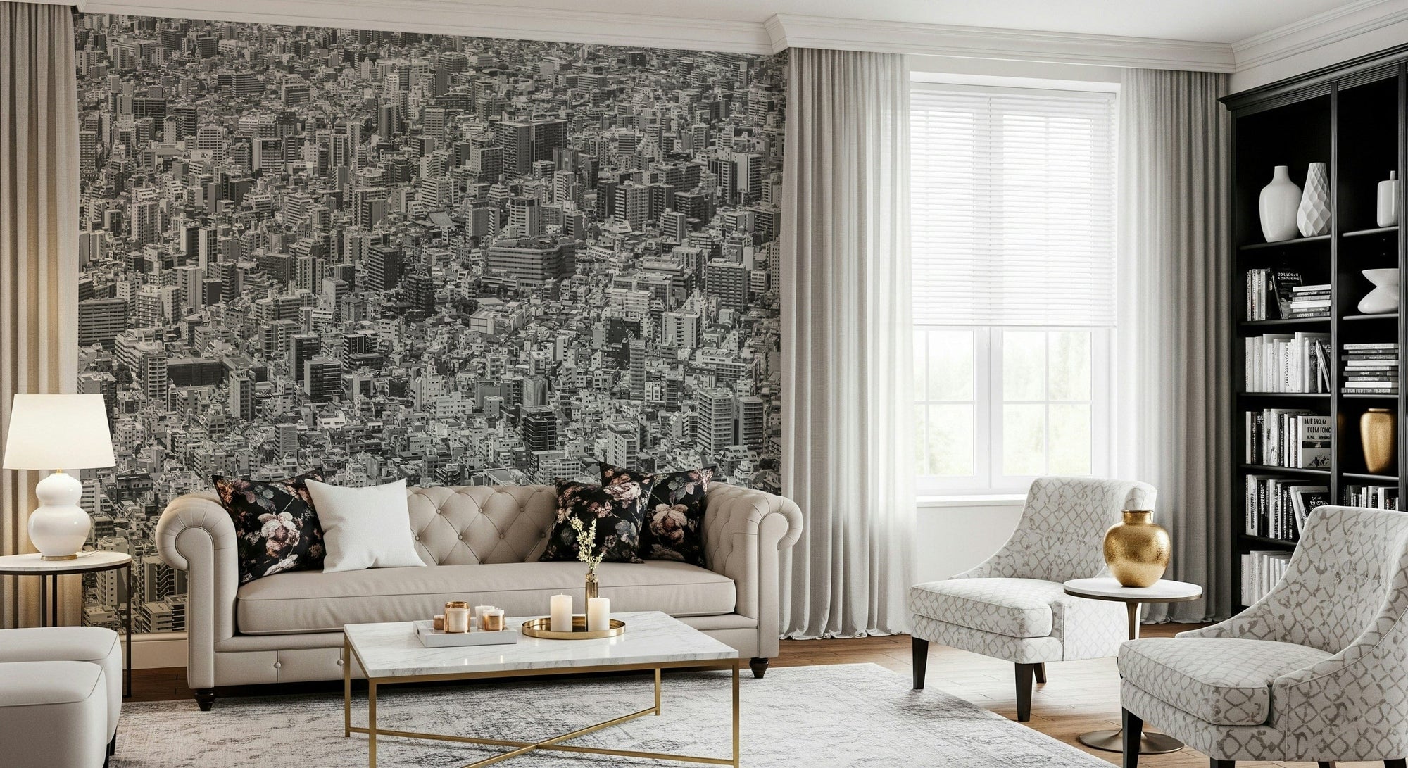 Metropolis Gridlock wallpaper mural of a dense black-and-white aerial cityscape behind a beige Chesterfield sofa and gold accents in a living room
