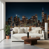 Urban Nightscape wallpaper mural of New York at night behind a white sofa and round walnut coffee table