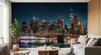 Urban Nightscape wallpaper mural of a glowing skyline and bridge beside a white sofa and potted plant