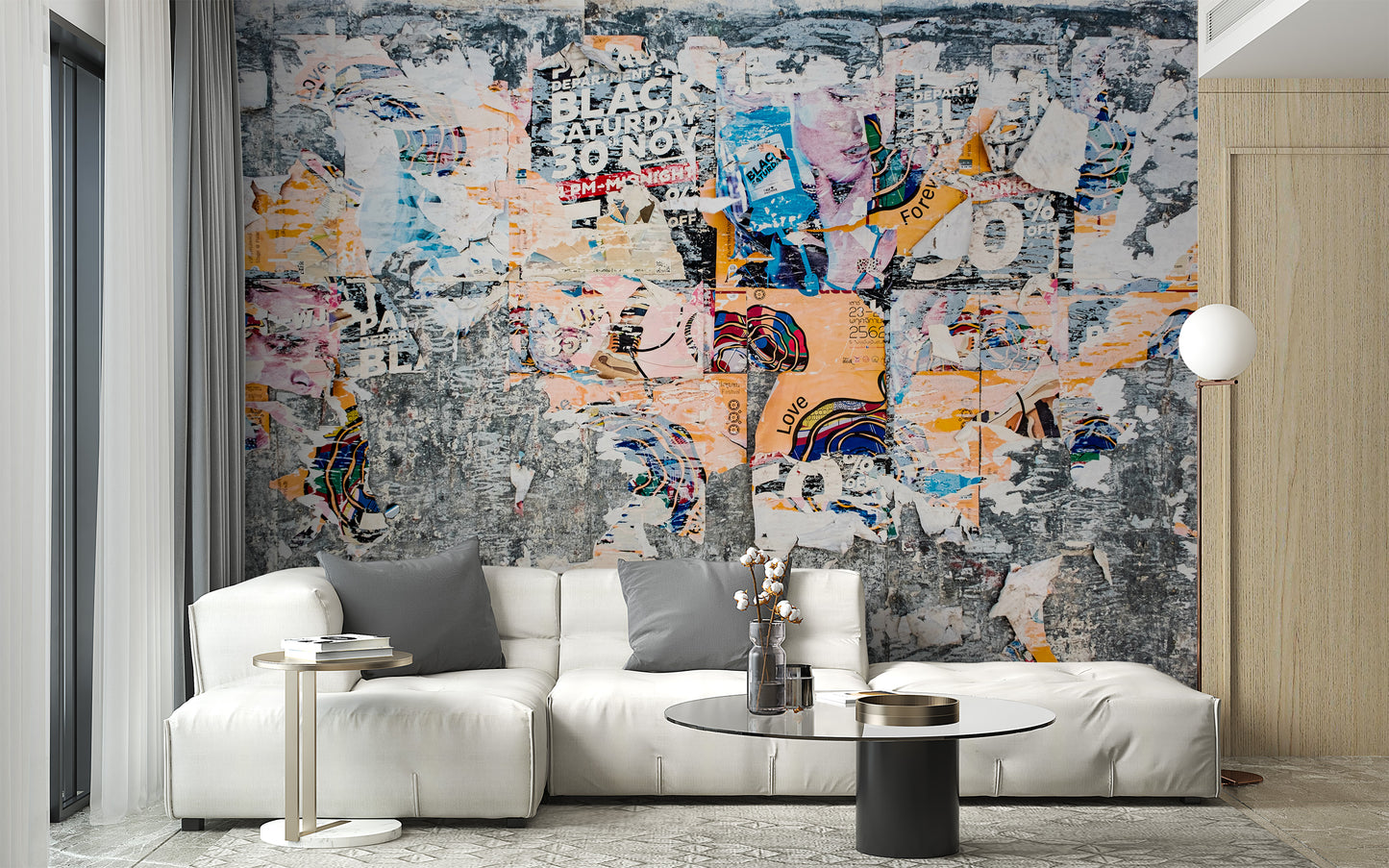 Urban Poster Patchwork wallpaper mural of torn collage posters behind a white sectional sofa in a living room