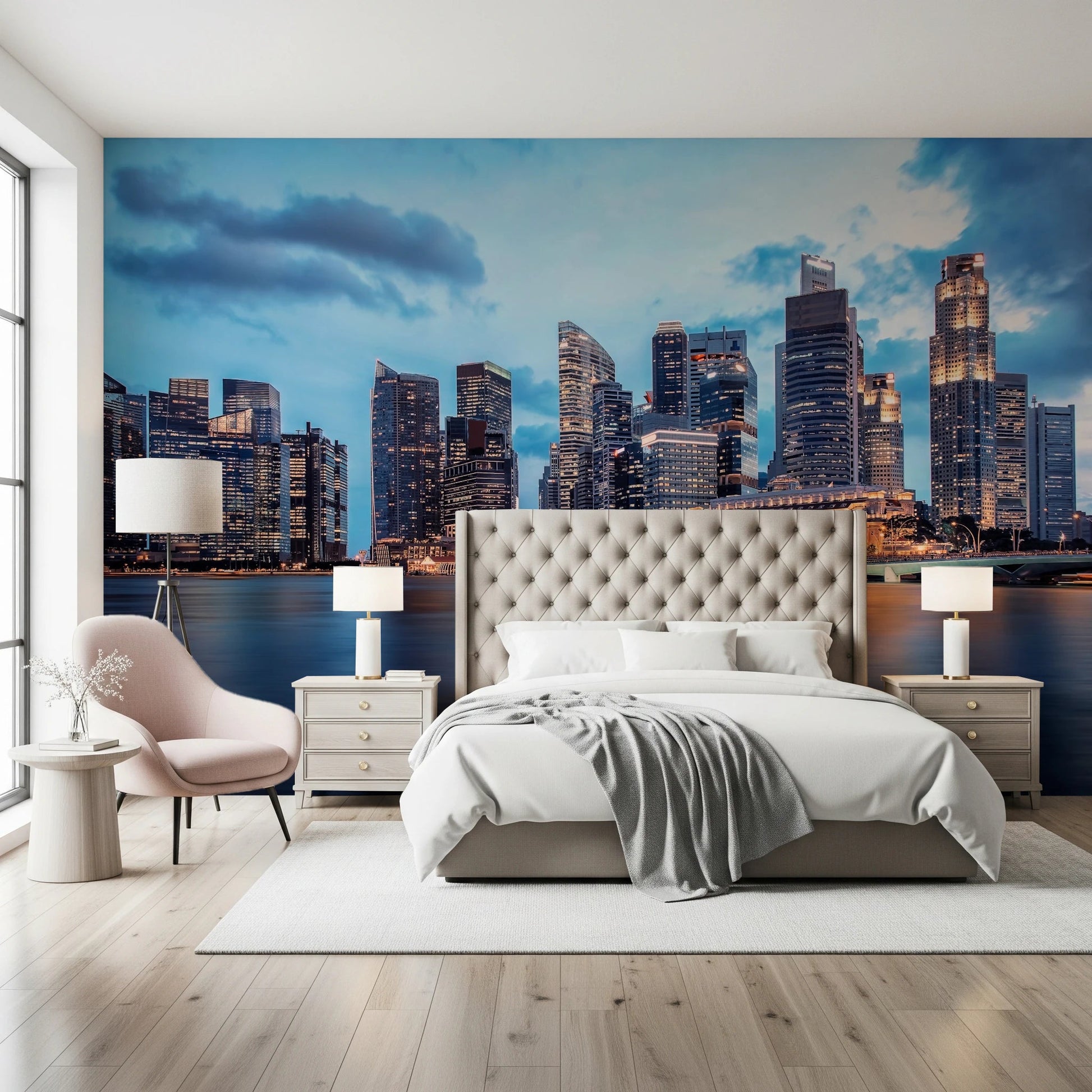 Urban Serenity wallpaper mural of a waterfront skyline behind a cream tufted bed with a pink accent chair