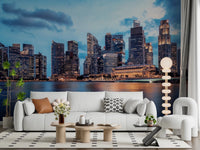 Urban Serenity wallpaper mural of a city skyline behind a white sofa and white accent chair in a living room