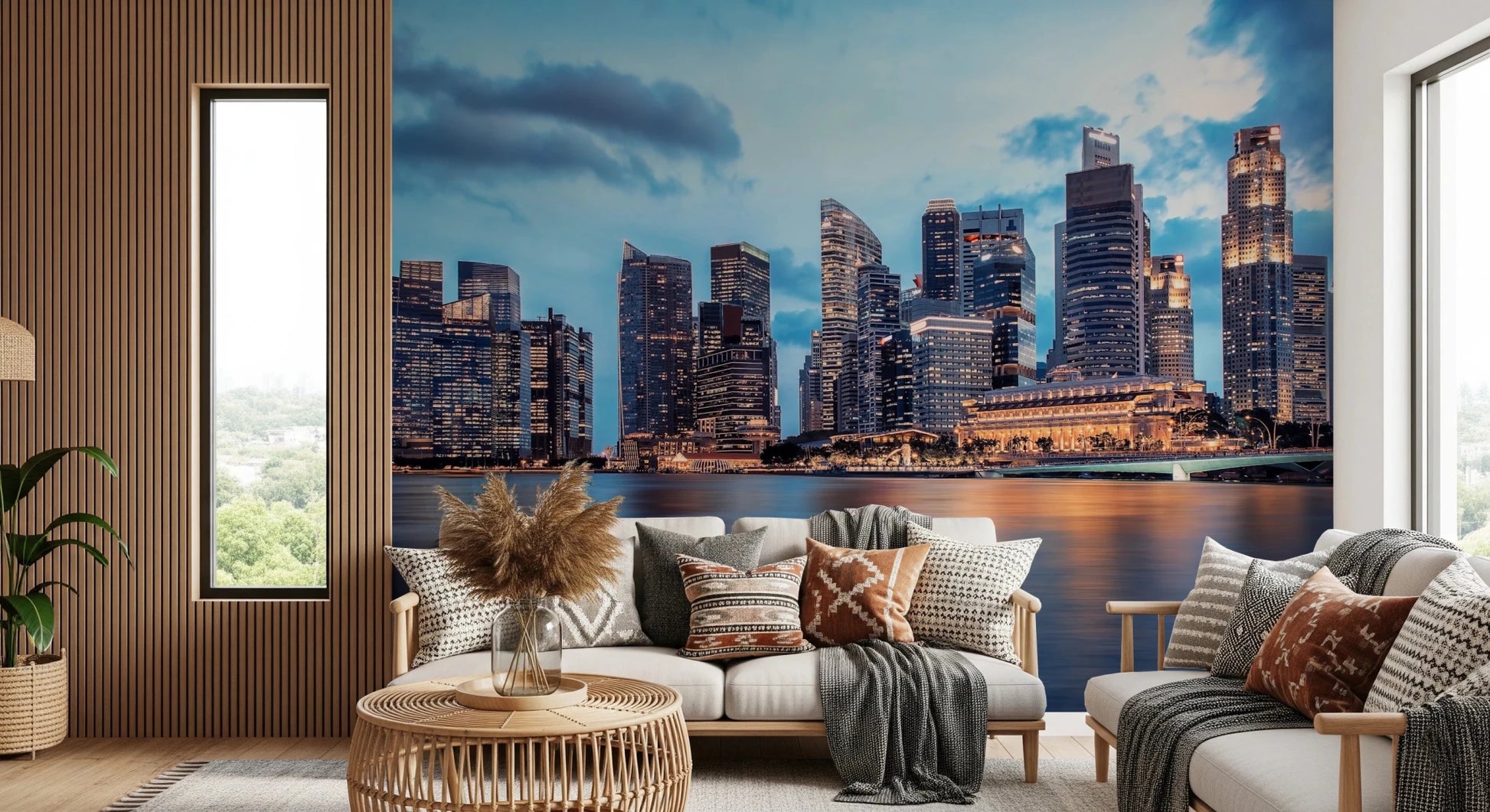 Urban Serenity wallpaper mural of a waterfront skyline behind a white sofa with boho pillows and a rattan coffee table