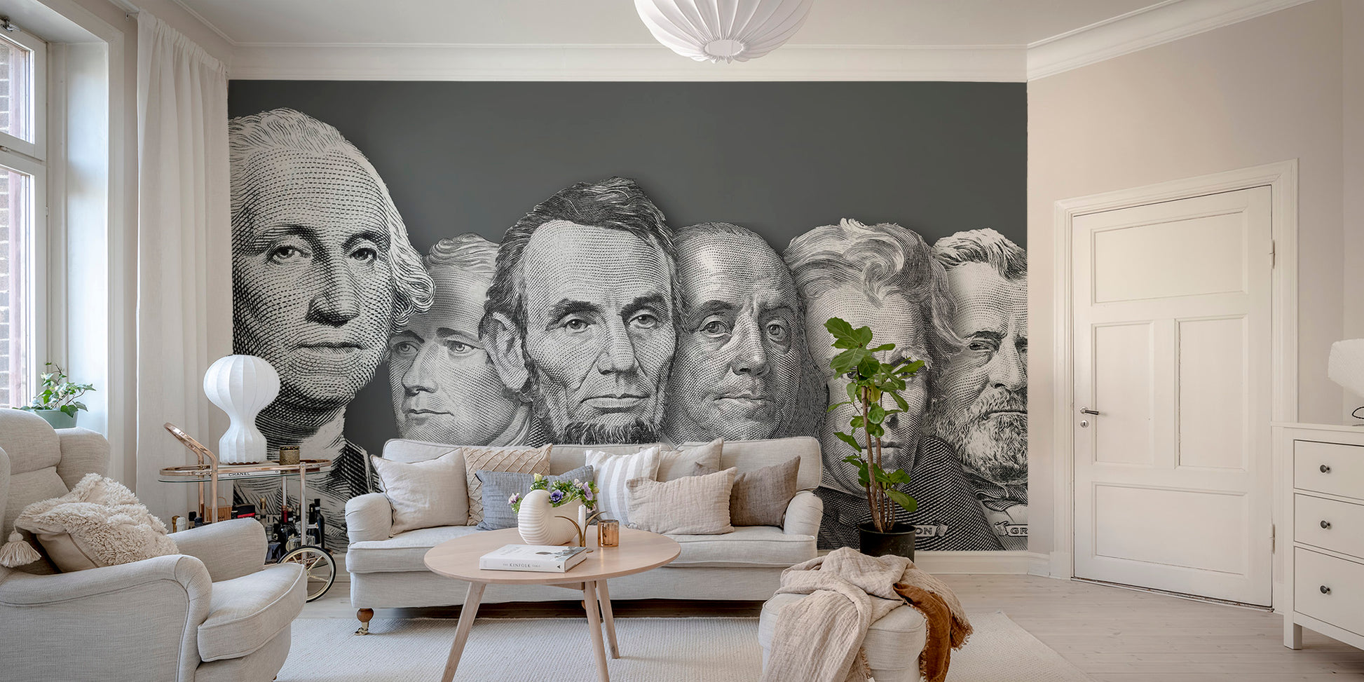 US presidential portraits currency wallpaper mural in grey on a charcoal wall behind a cream sofa in a living room