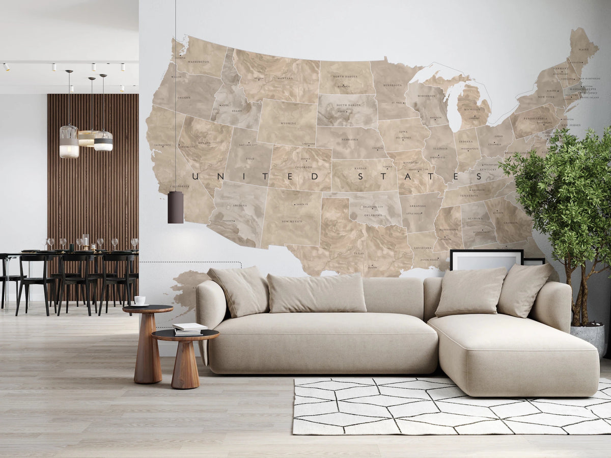 USA map with states and capitals in tan watercolor wallpaper mural behind a beige sectional sofa in a living room