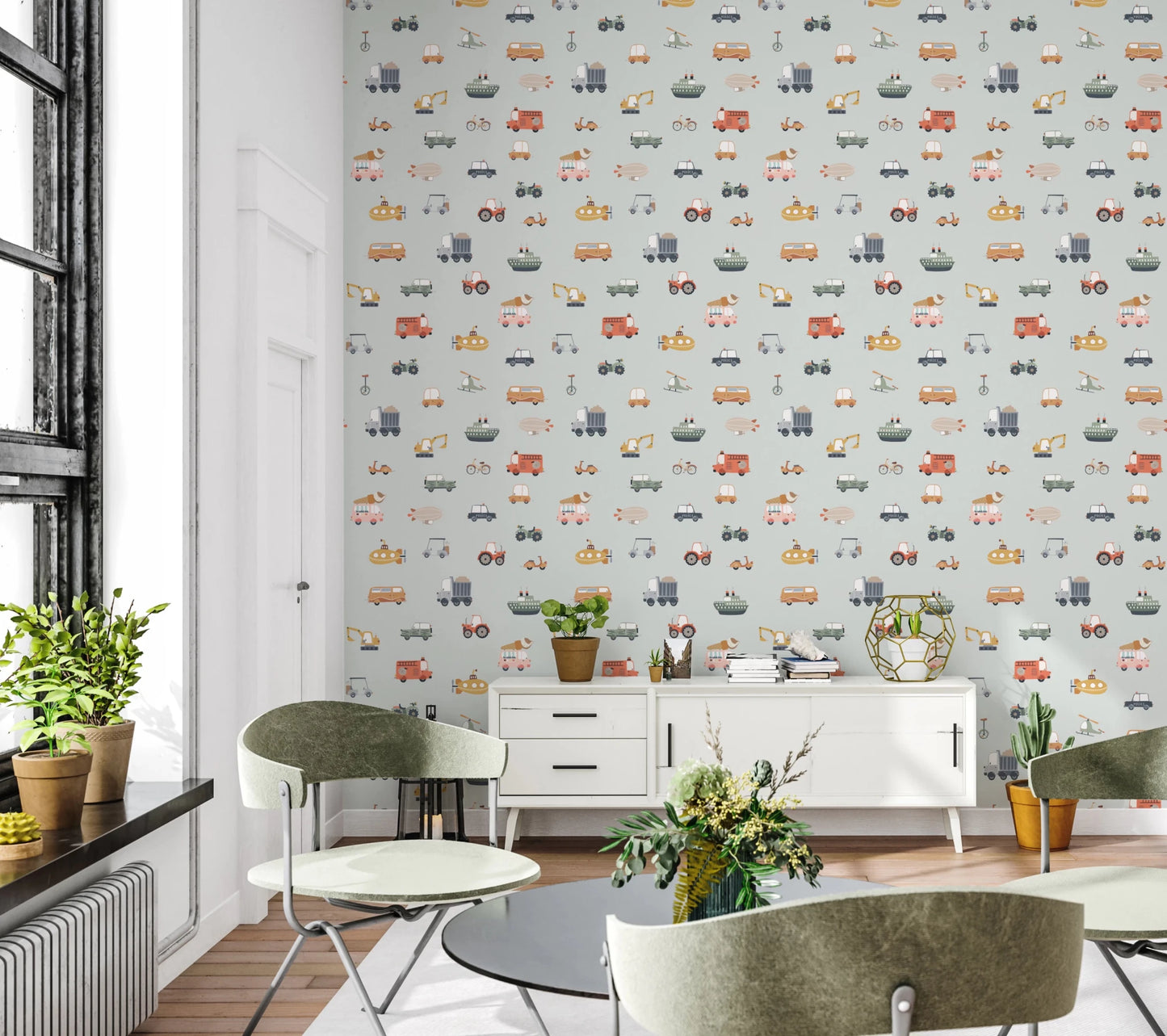 Vehicles in blue background wallpaper behind a white sideboard and green chairs in a loft-window living room