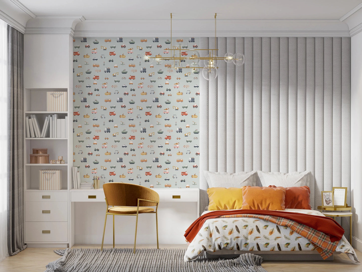 Vehicles in blue background wallpaper above a white desk beside a bed with orange cushions in a child's bedroom