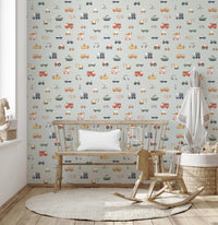 Vehicles in blue background wallpaper in a kids room with wooden bench, rocking horse and toy basket