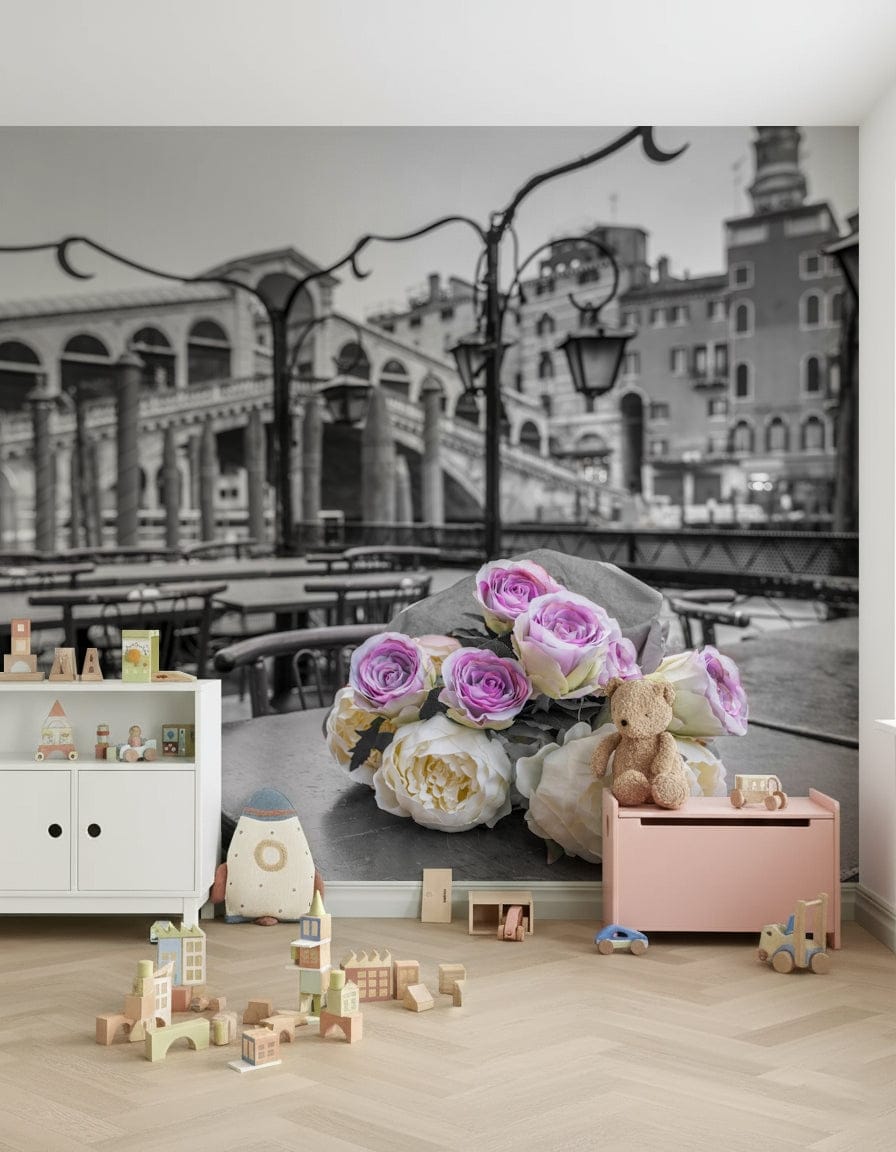 Venetian Blooms wallpaper mural with Venice Rialto Bridge and roses in a kids playroom with pink toy chest and wooden blocks
