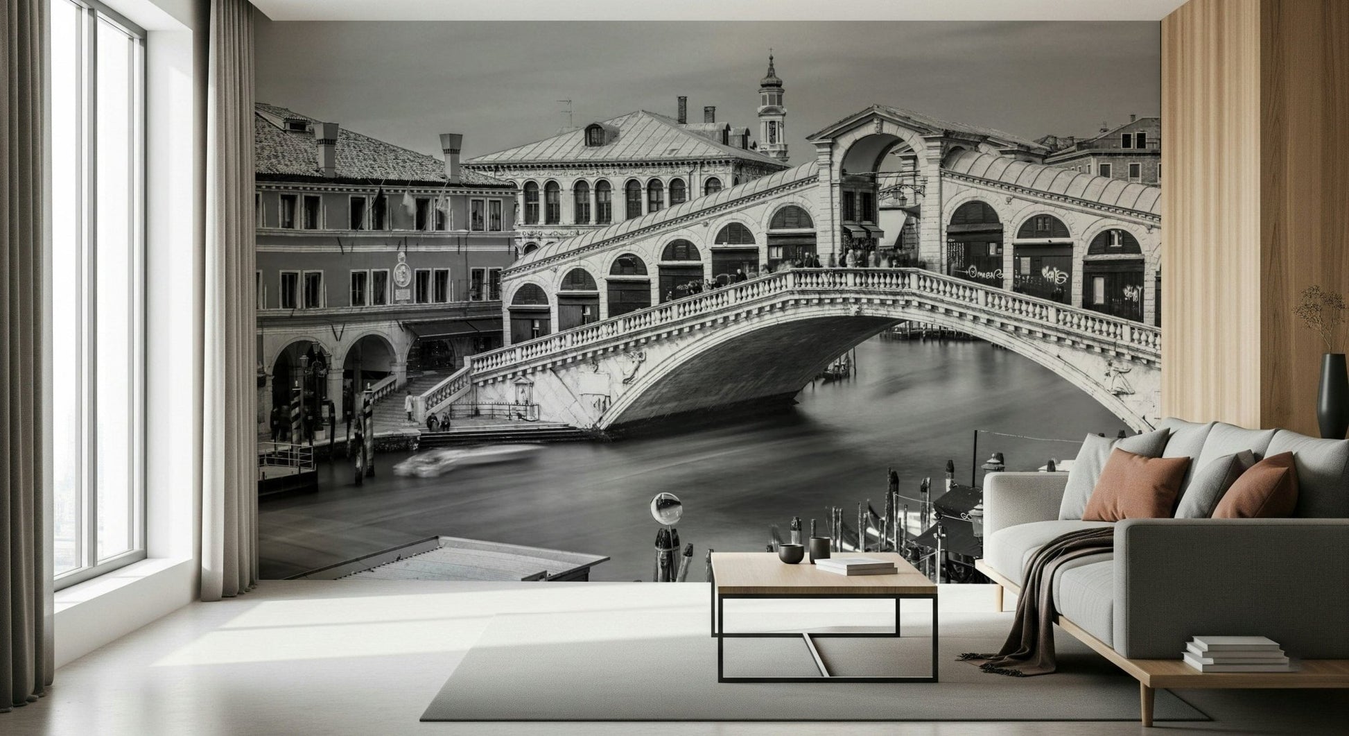 Venetian Bridge Serenity wallpaper mural of the Rialto Bridge in a bright living room with grey sofa and large windows