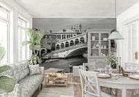 Venetian Bridge Serenity wallpaper mural of the Rialto Bridge behind a floral sofa near a white dining table and hutch