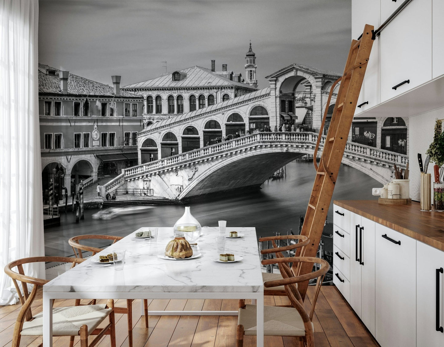 Venetian Bridge Serenity wallpaper mural of the Rialto Bridge in a kitchen with marble table and wishbone chairs