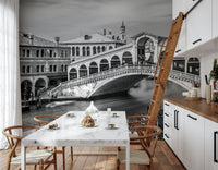 Venetian Bridge Serenity wallpaper mural of the Rialto Bridge in a kitchen with marble table and wishbone chairs