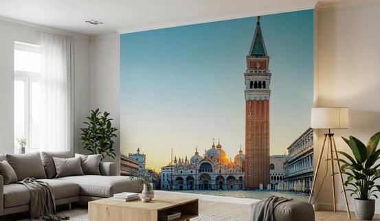 Venetian Sunrise wallpaper mural of St Mark's Campanile at sunrise above a grey sectional and wood coffee table