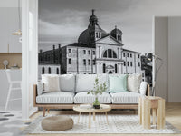 Venice Cityscape wallpaper mural of a grey domed church behind a white sofa with mint pillow and wood side table