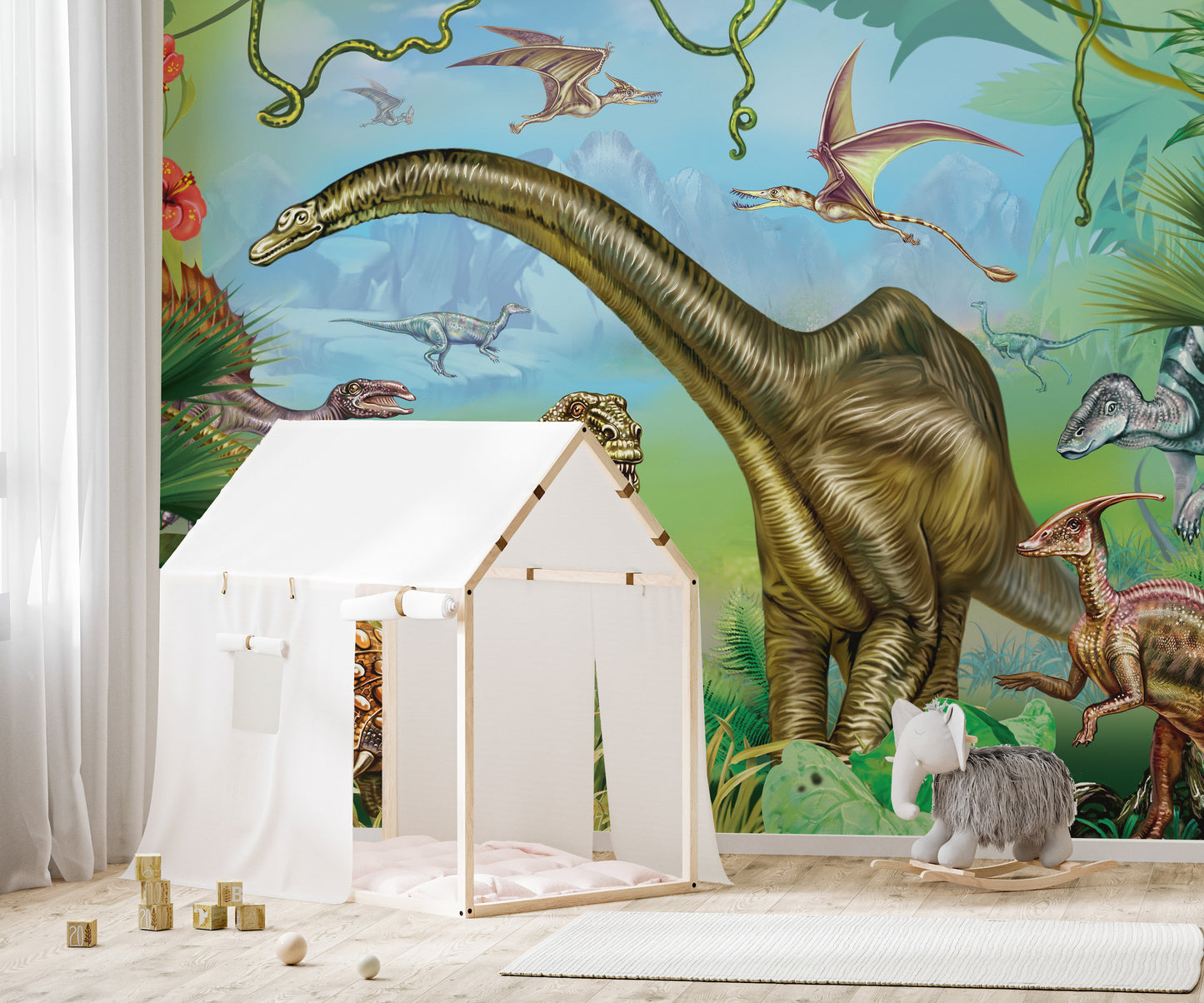Vibrant colored Dinosaur World wallpaper mural as a feature wall in a home office workspace in green tones