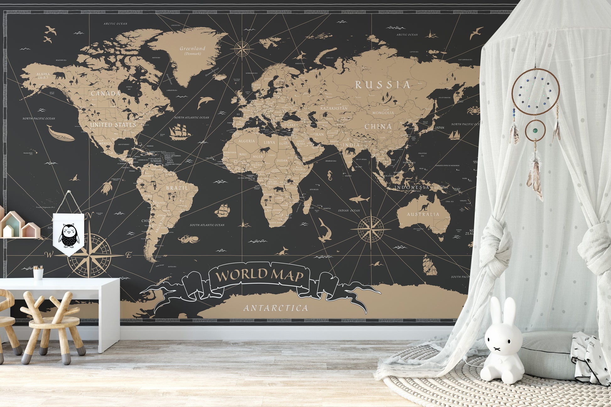 Vintage Black Golden World Map wallpaper mural in black and gold beside a white canopy tent in a nursery
