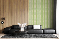 Vintage Bloom Rows wallpaper mural in a living room beside a wood slat wall and black leather sectional, green stripes