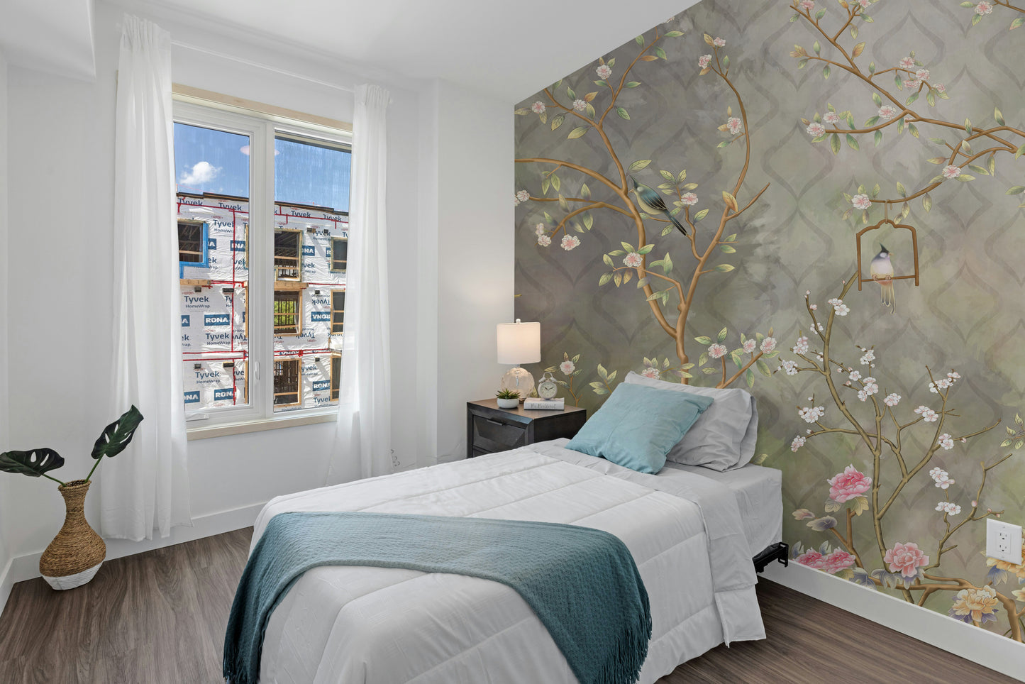 Temporary vintage garden mural behind a brown leather sofa in a stylish lounge with industrial-style lighting.