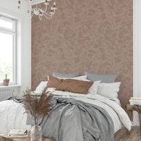 Solid blush wallpaper in cozy reading nook


